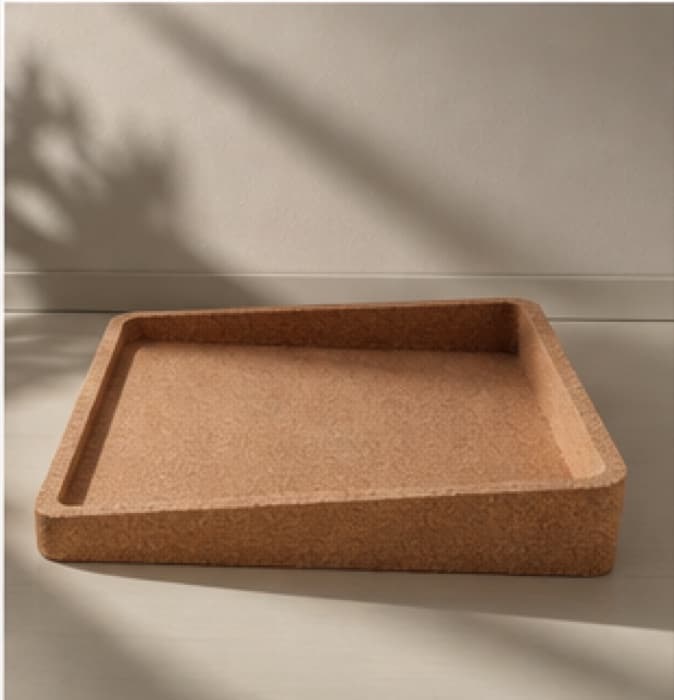 The bare cork base, its grain visible in raking light